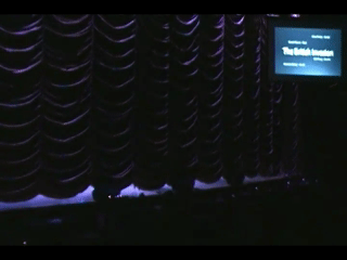 Curtain Rising to reveal a band about to perform.