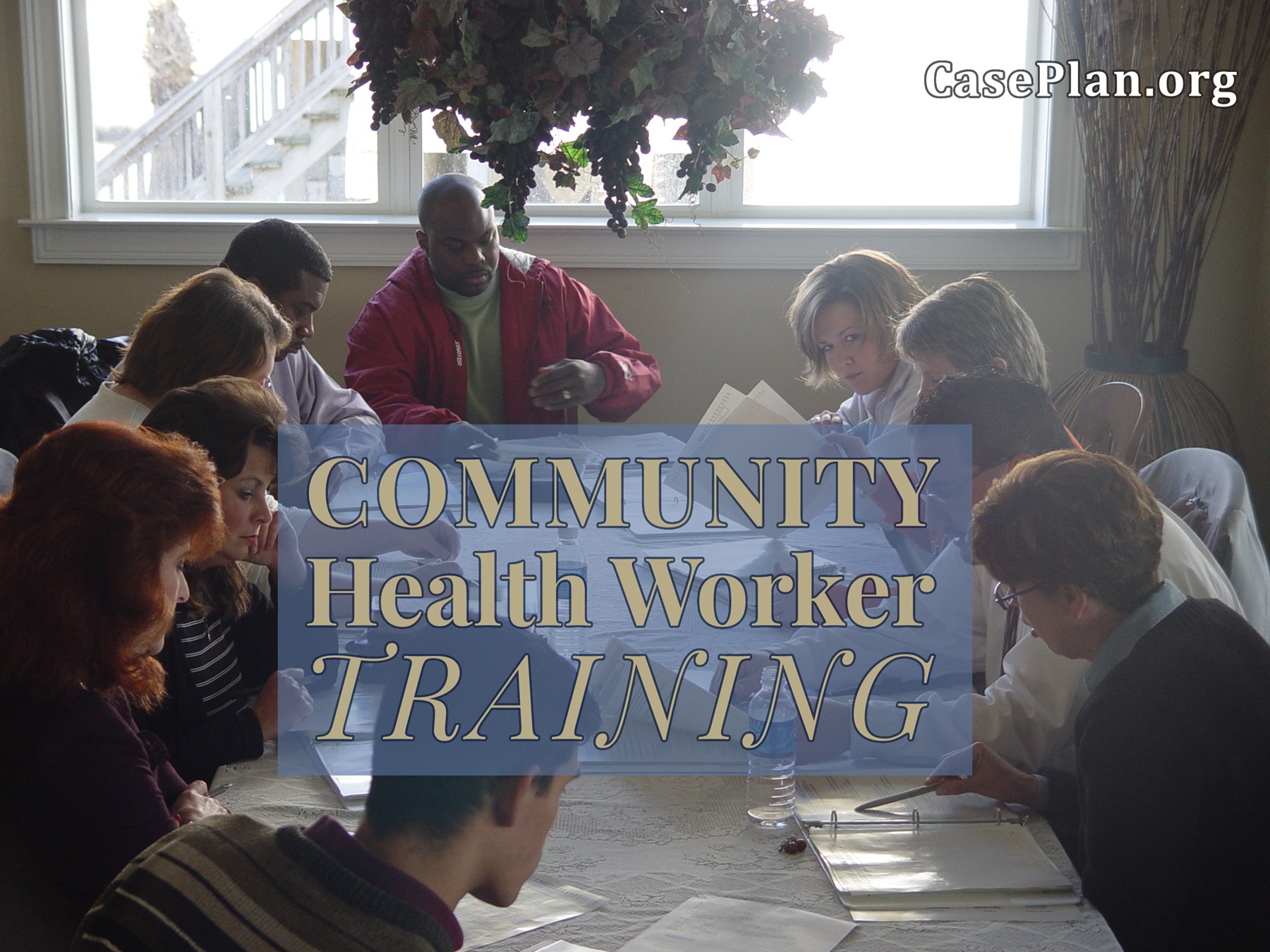 Students around a table reviewing and discussing Community Health Work